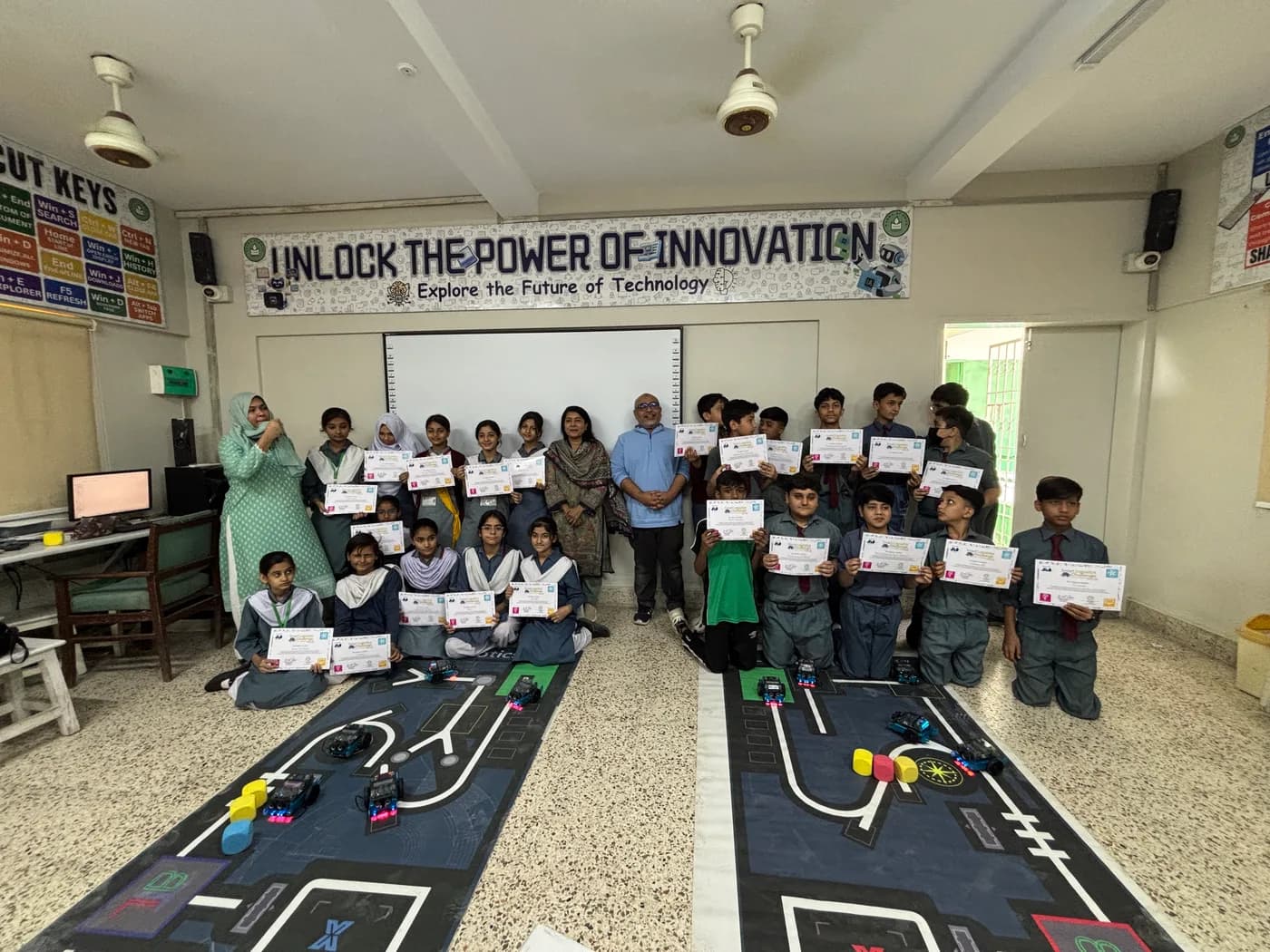 Students with their certificates at a JBS robotics and technology workshop